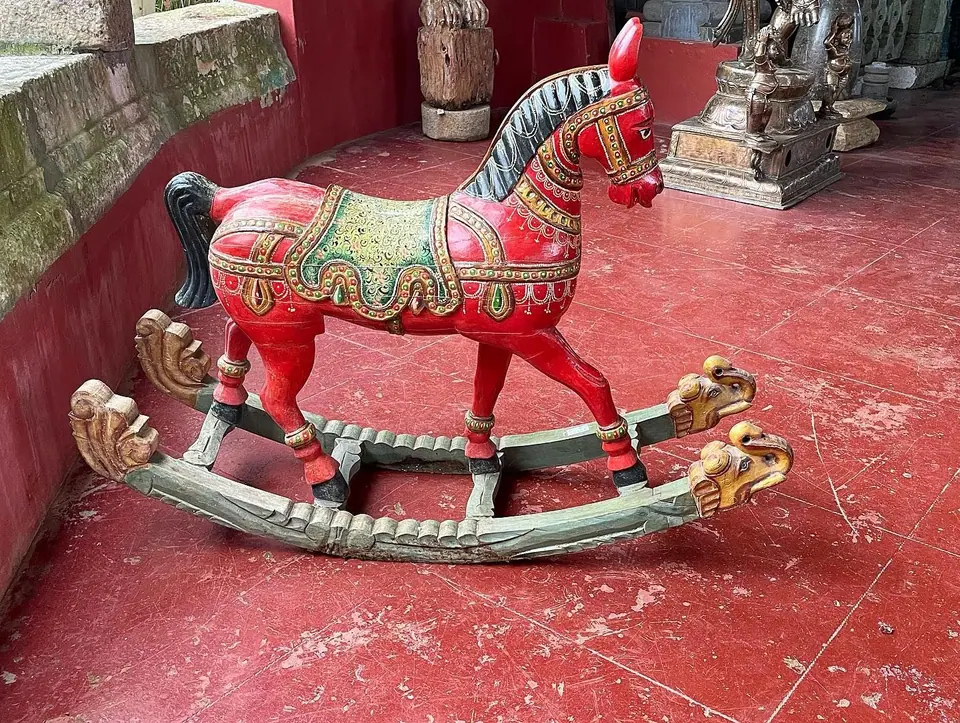 A hand-painted wooden rocking horse