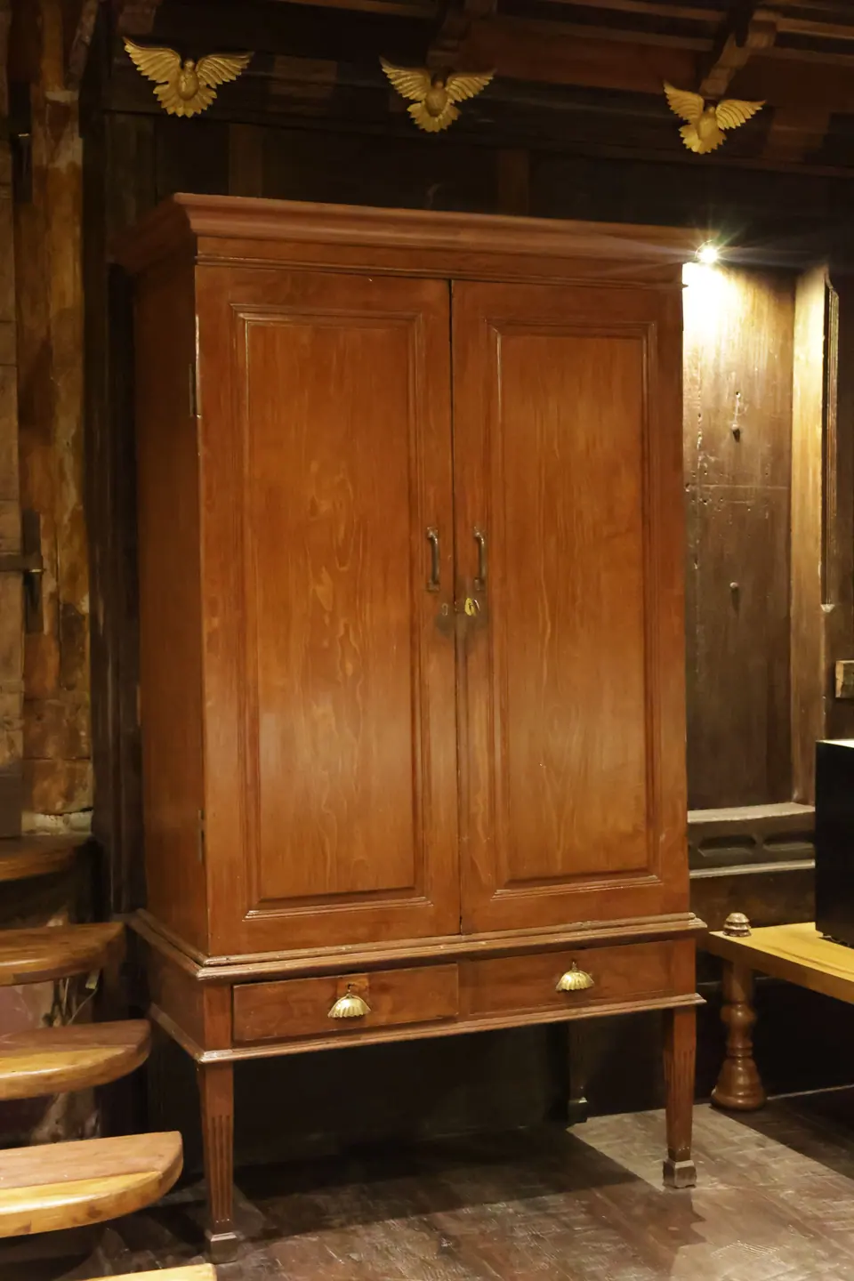 A wooden wardrobe with double doors